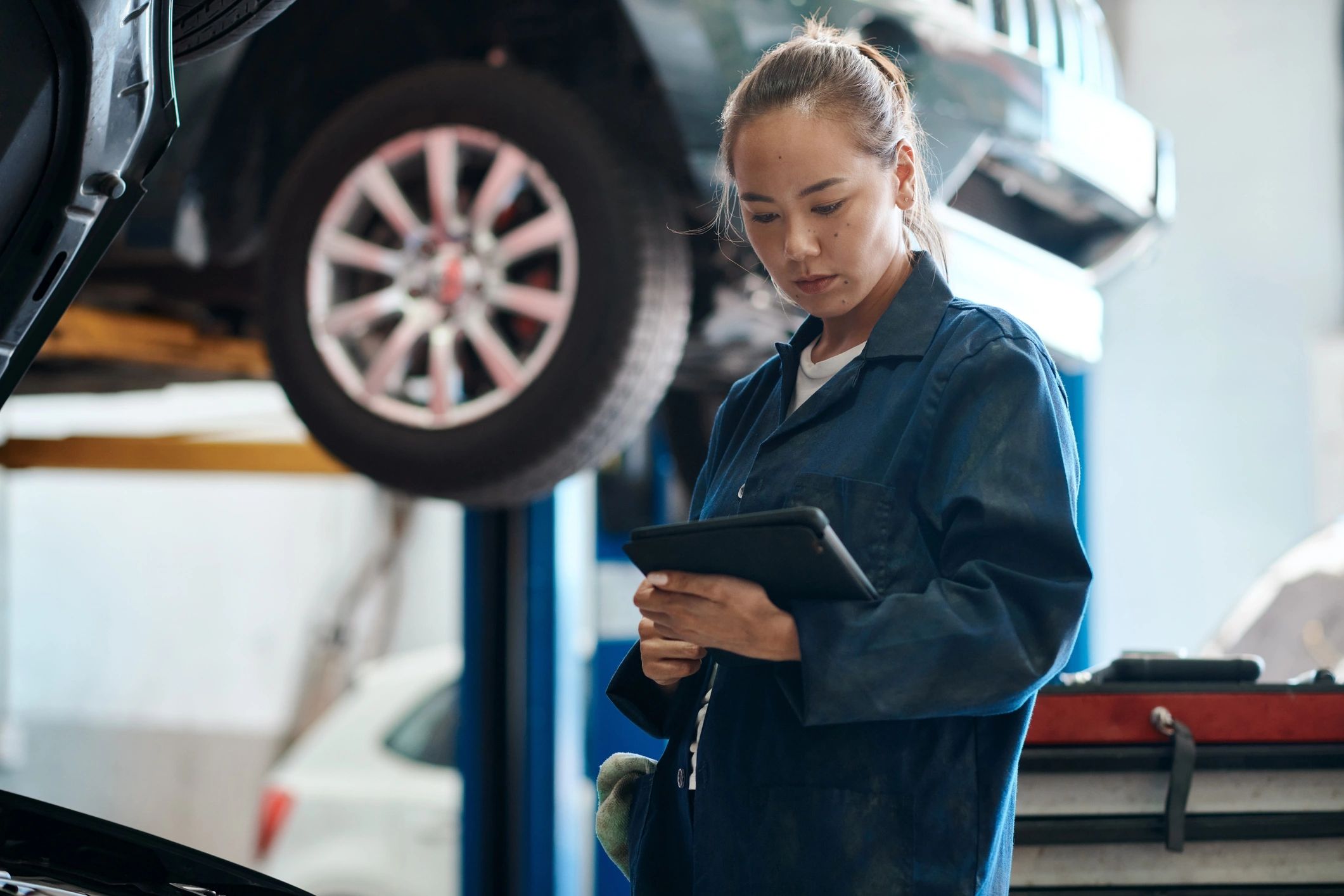 Technician reviewing EV battery test details in Ashmore, QLD