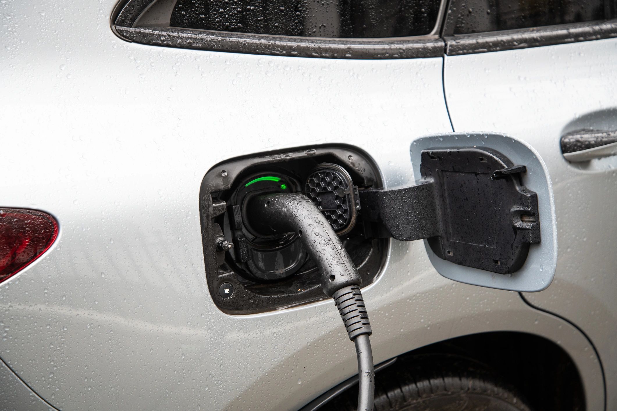EV charging plug connected to a vehicle for battery health testing
